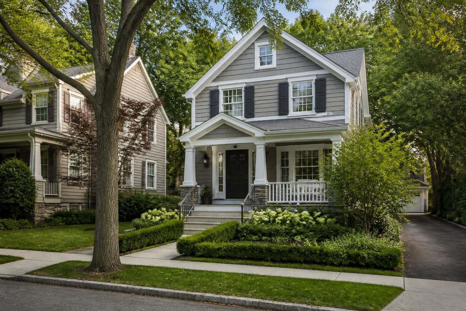 Attractive neighborhood streetscape with homes and mature landscaping.